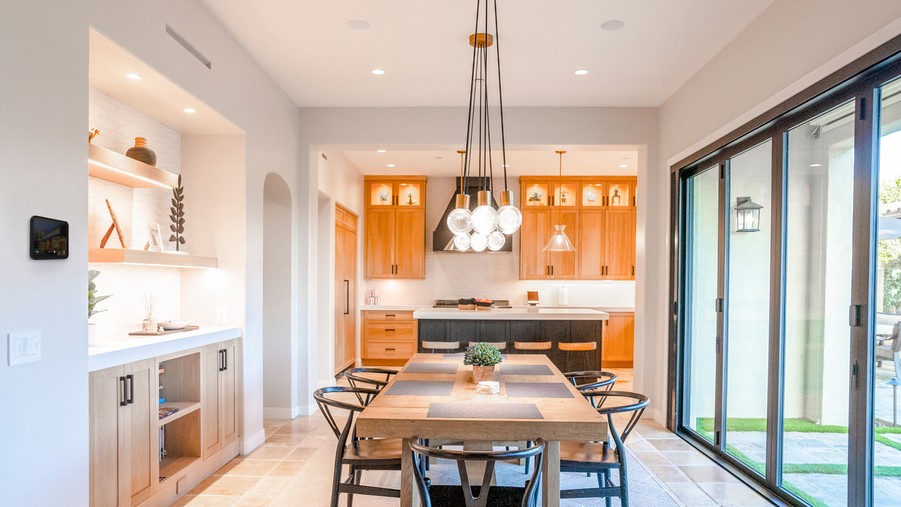 A home’s dining room with Sonance in-ceiling speakers.